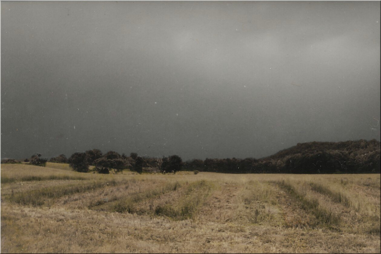barn field and storm clouds.jpg